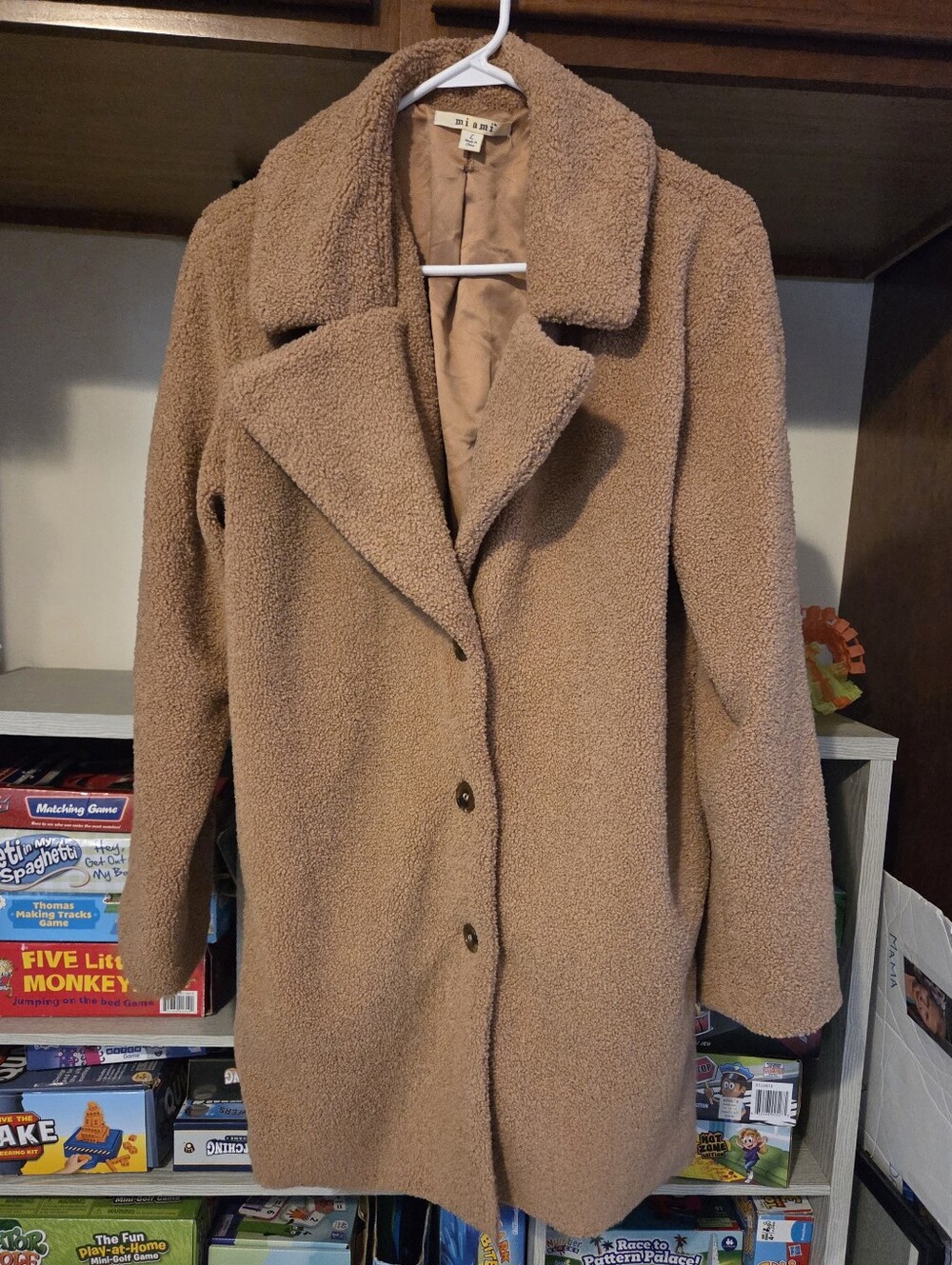 Mi Ami Faux Fur Teddy Bear Coat. It is a mid-length, single-breasted winter fall